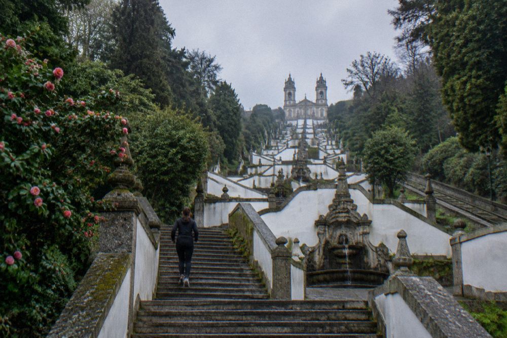 The granite stairway of Bom Jesus do Monte with its stone fountains climbing through trees toward the church