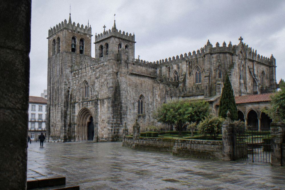 The Romanesque towers and stonework of Braga Cathedral seen from the square in the historic centre