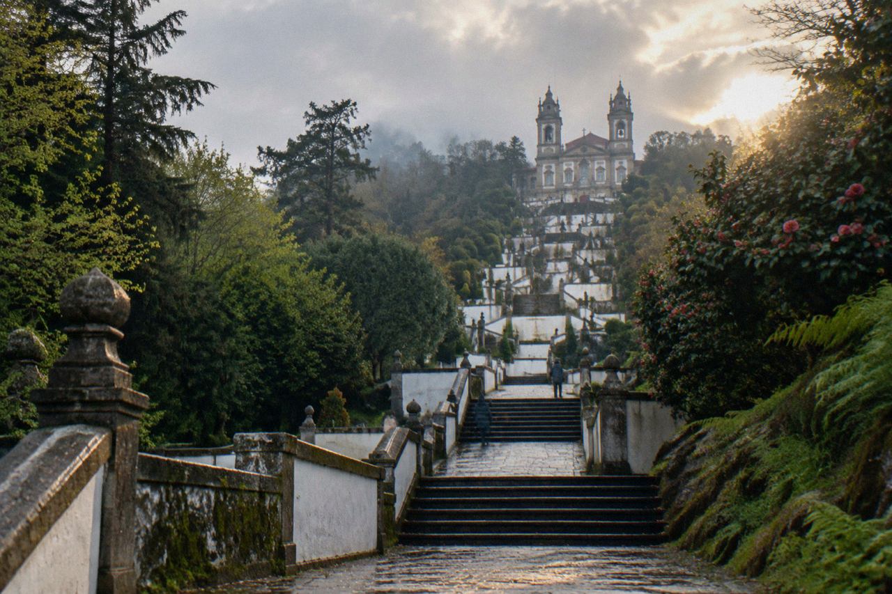 The baroque stairway and sanctuary of Bom Jesus do Monte rising above the wooded hills east of Braga