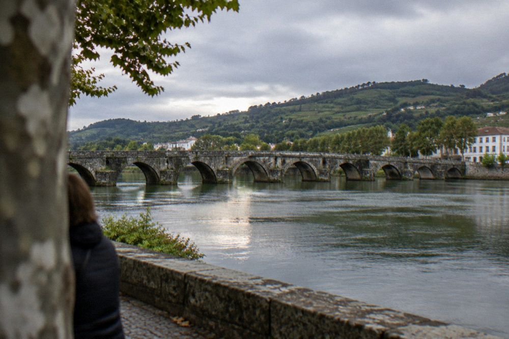 The Lima river and medieval bridge at Ponte de Lima seen from the riverside path