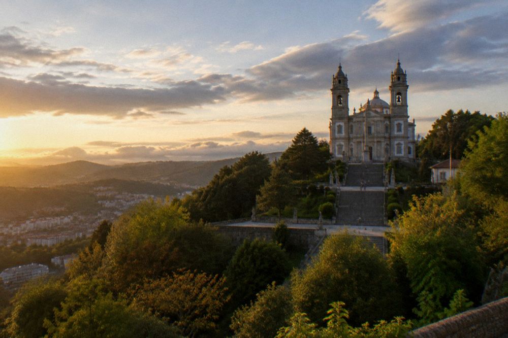 The twin-towered basilica of Sameiro seen across a green hillside above Braga